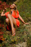 A smiling and confident Sofy frolics among the grass from Met-Art