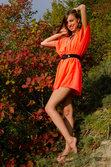 A smiling and confident Sofy frolics among the grass from Met-Art