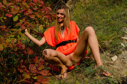 A smiling and confident Sofy frolics among the grass from Met-Art