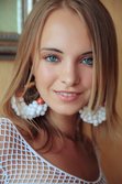 With her bright blue eyes sparkling like two precious gems from Met-Art