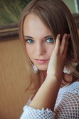 With her bright blue eyes sparkling like two precious gems from Met-Art